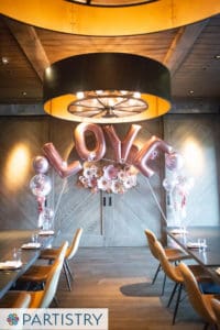 Custom balloon feature installation by Partistry Balloons