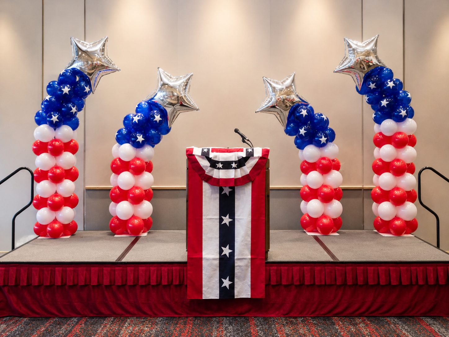 Patriotic star balloon columns on stage