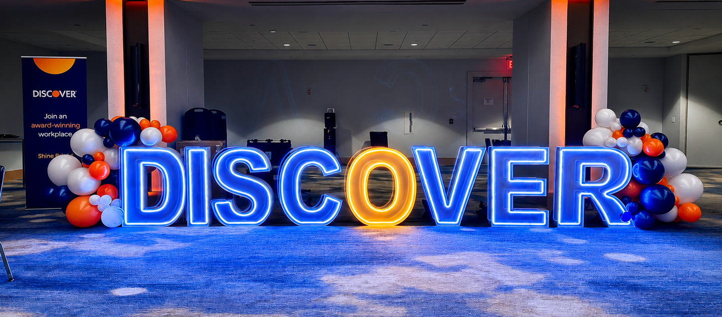 Orange and blue DISCOVER LED marquee letters corporate event