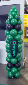 Green Crayon Balloon Column Green crayon-themed balloon column at an Amazon back-to-school event in Maryland