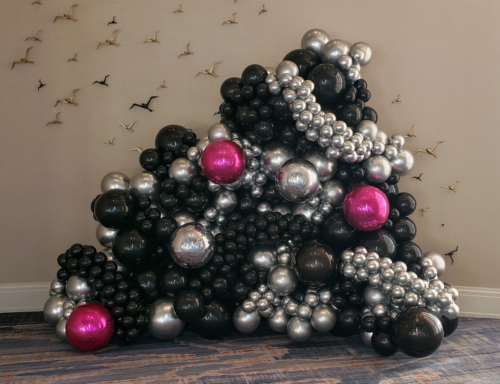 Organic magenta balloon wall by Partistry Balloons