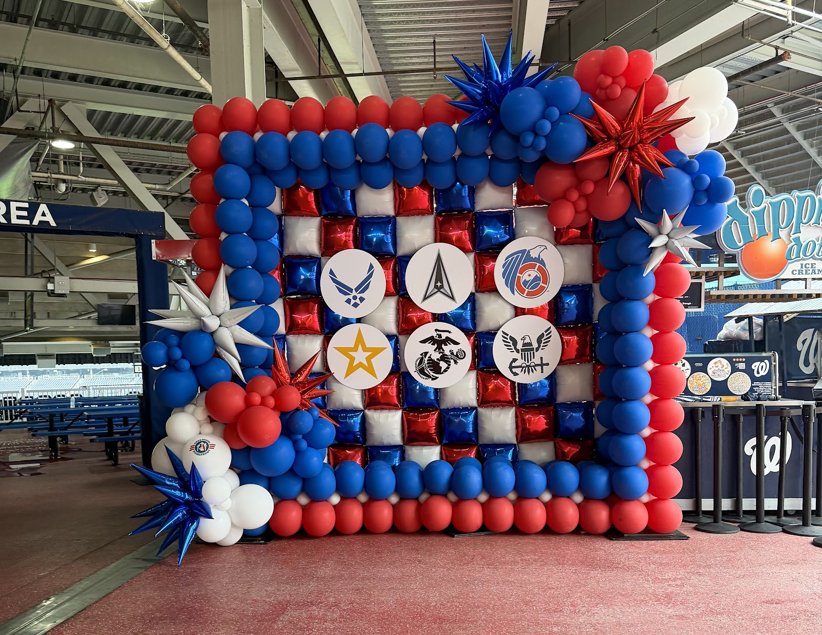 Patriotic outdoor balloon wall by Partistry Balloons