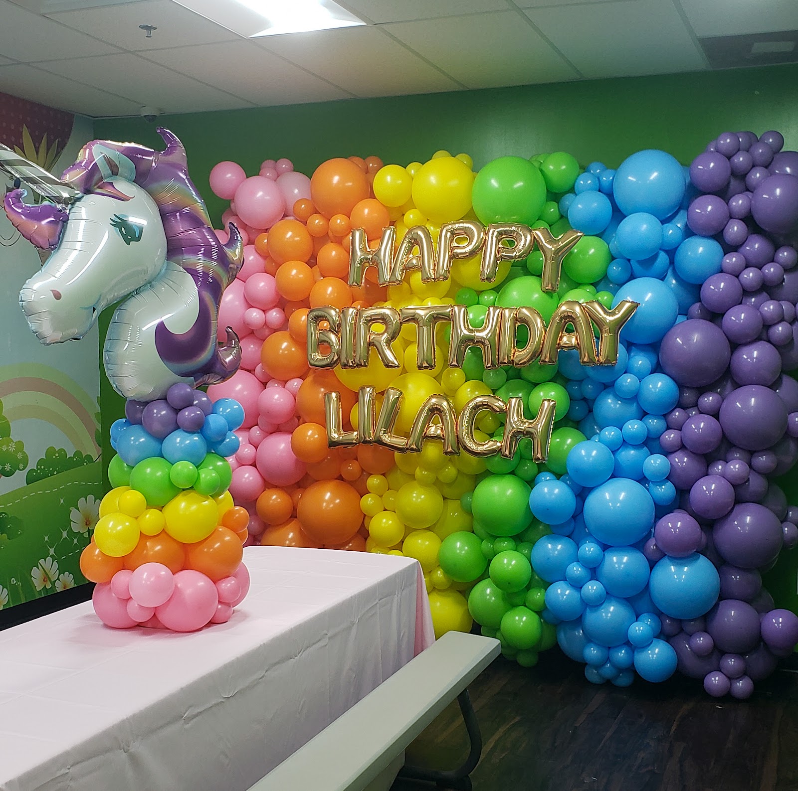 Rainbow unicorn balloon wall by Partistry Balloons
