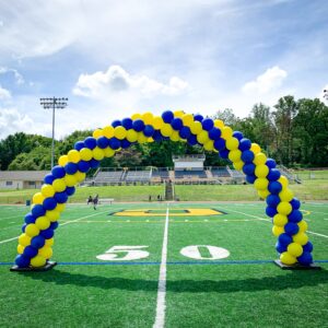 Classic spiral balloon arch on a football field